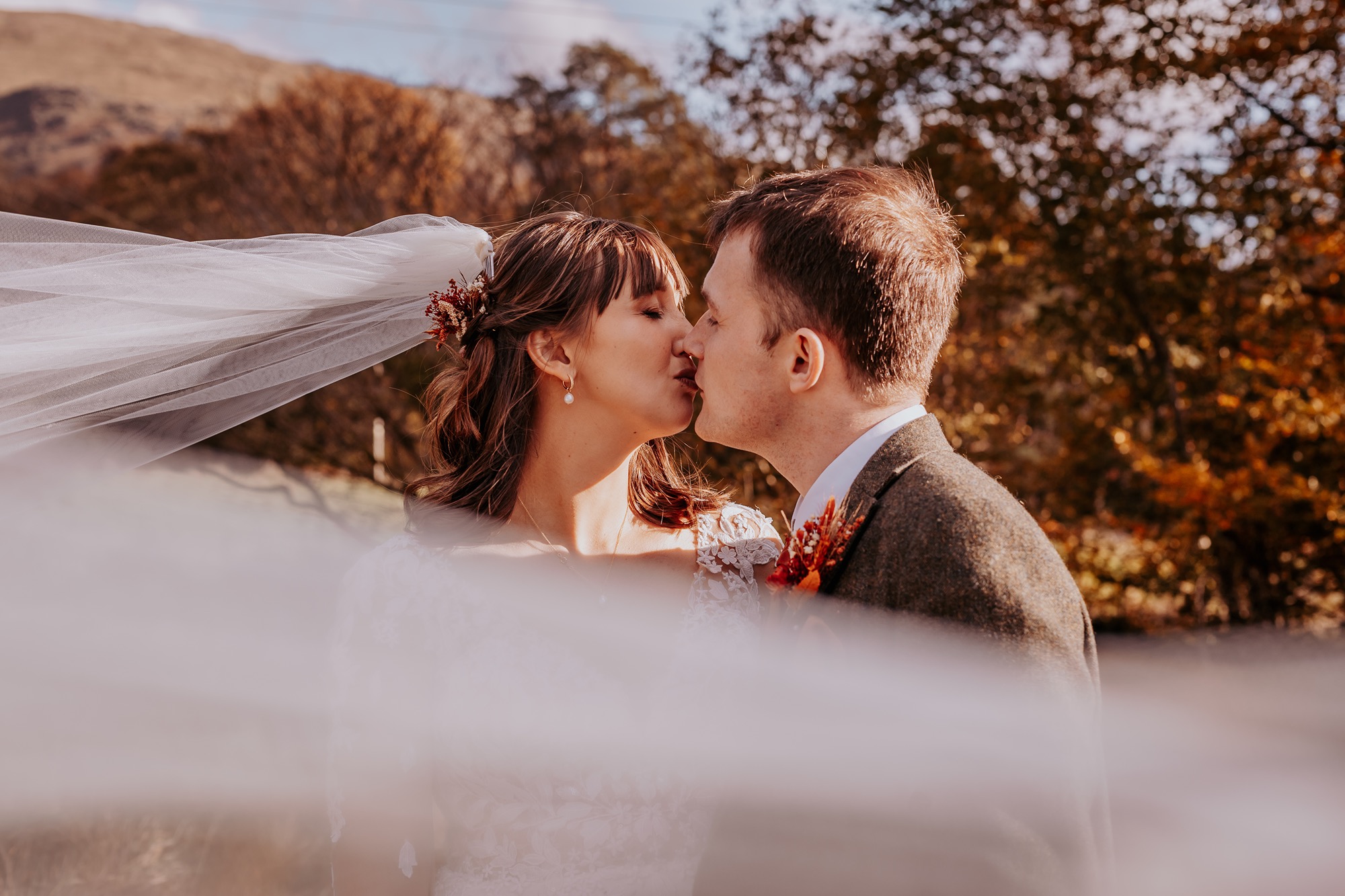 Bride and groom kissing at Lancrigg, Grasmere, Lake District