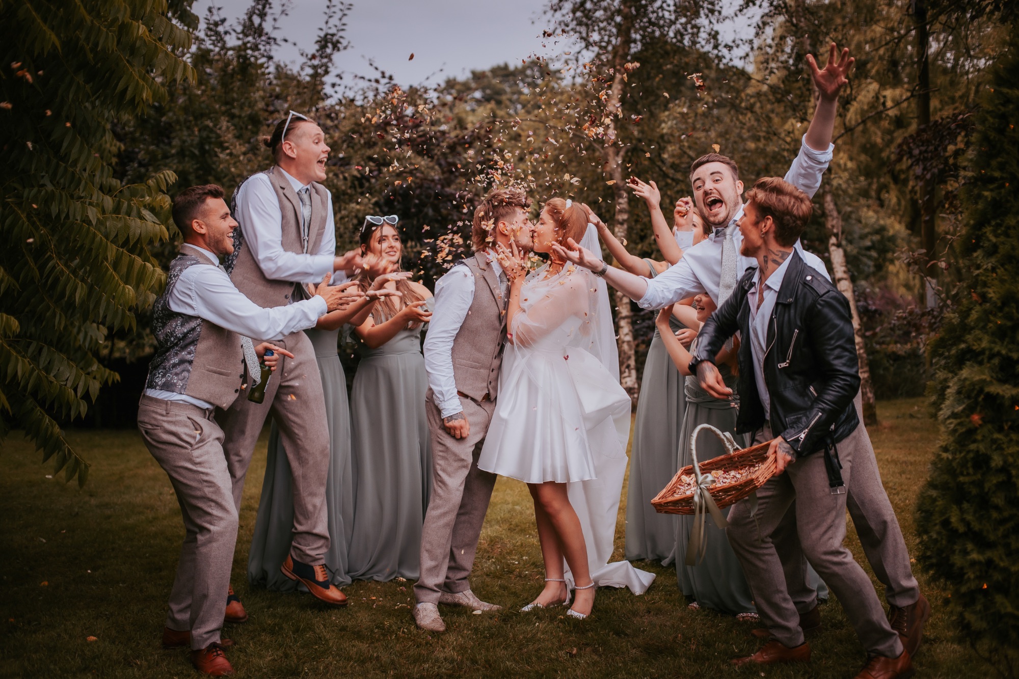 Countryside wedding North Yorkshire, Confetti throwing group portrait