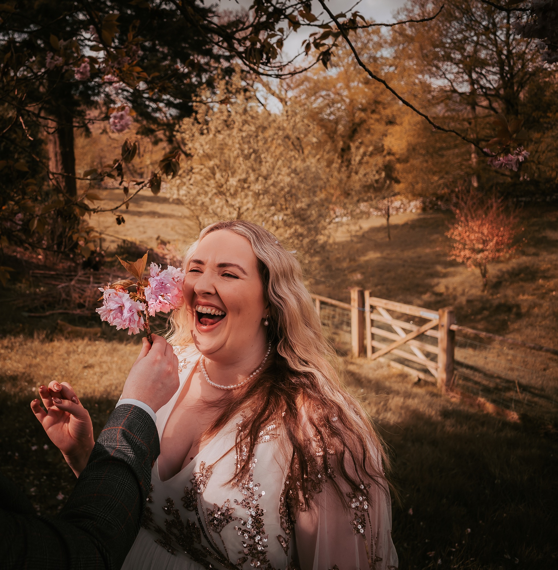 flowers stroke brides cheek making her laugh