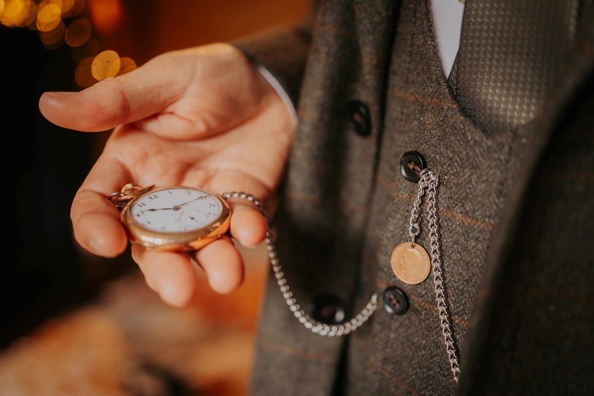 Groom checking time as he waits for his bride at Cote How