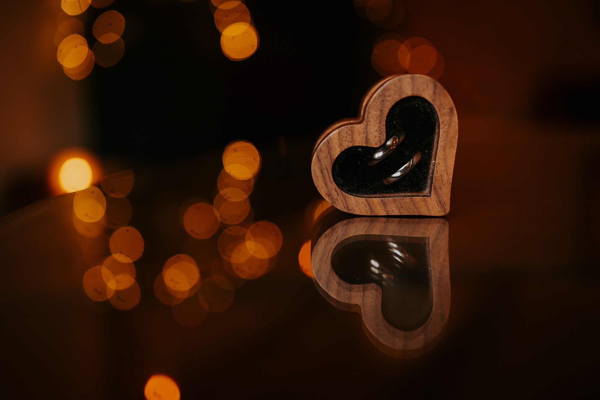 wedding rings on a table at Cote How