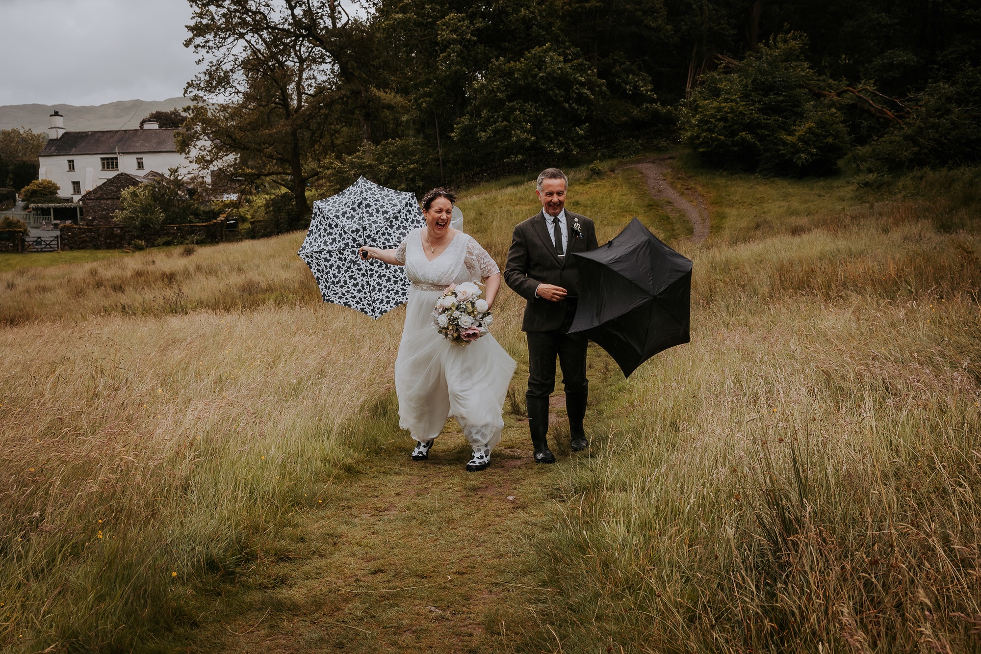 stormy, windswept wedding at Cote How, as couple adventure Rydal water