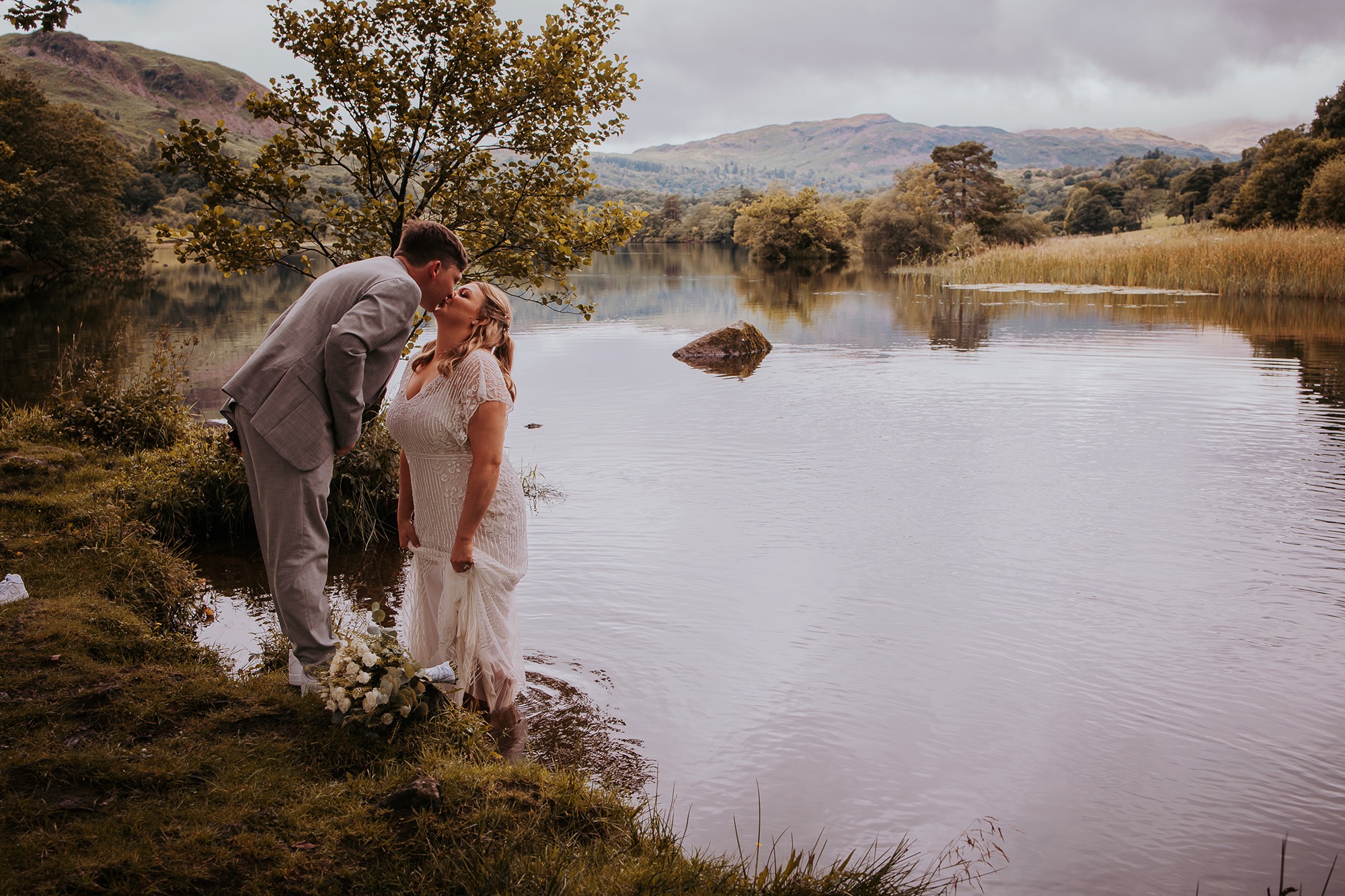 Couple kiss on the shores of Rydal