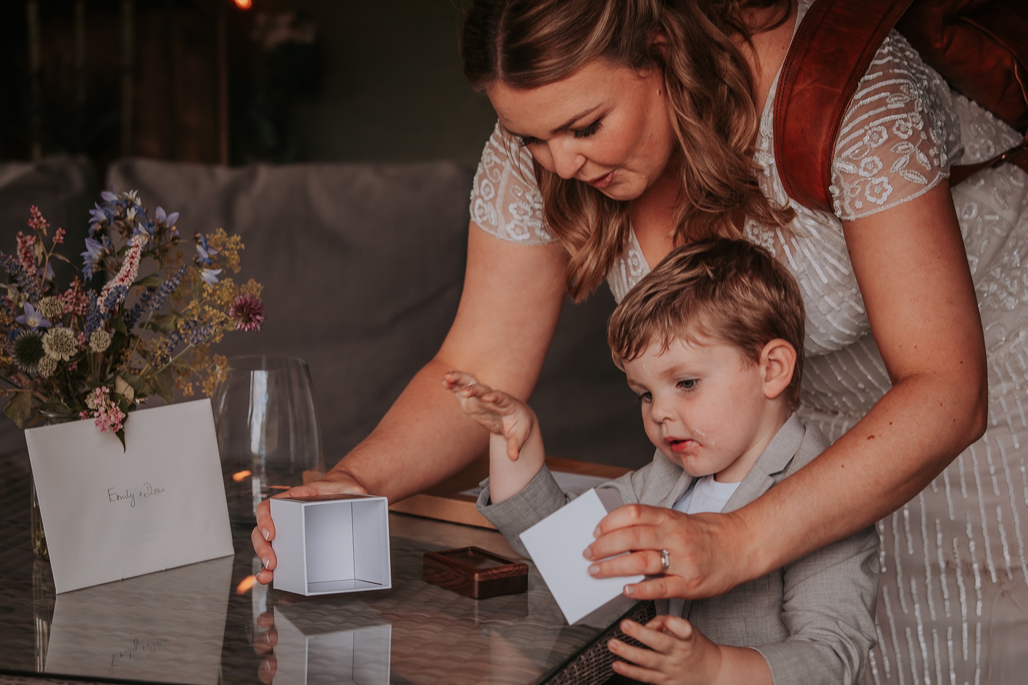 Little boy enjoys the gift from Cote How after his parents elope