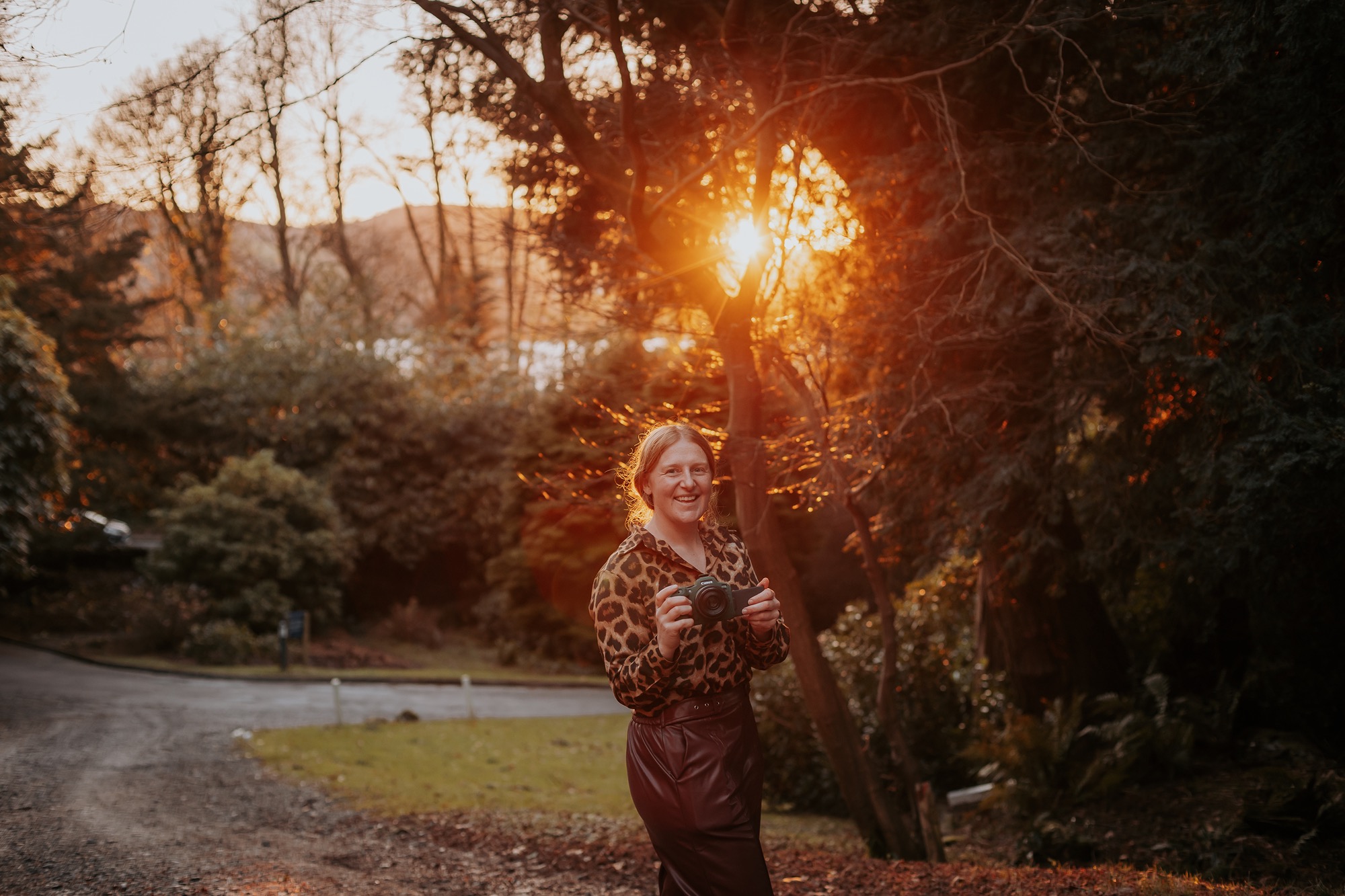 Female photographer in the Lake District as the sunsets