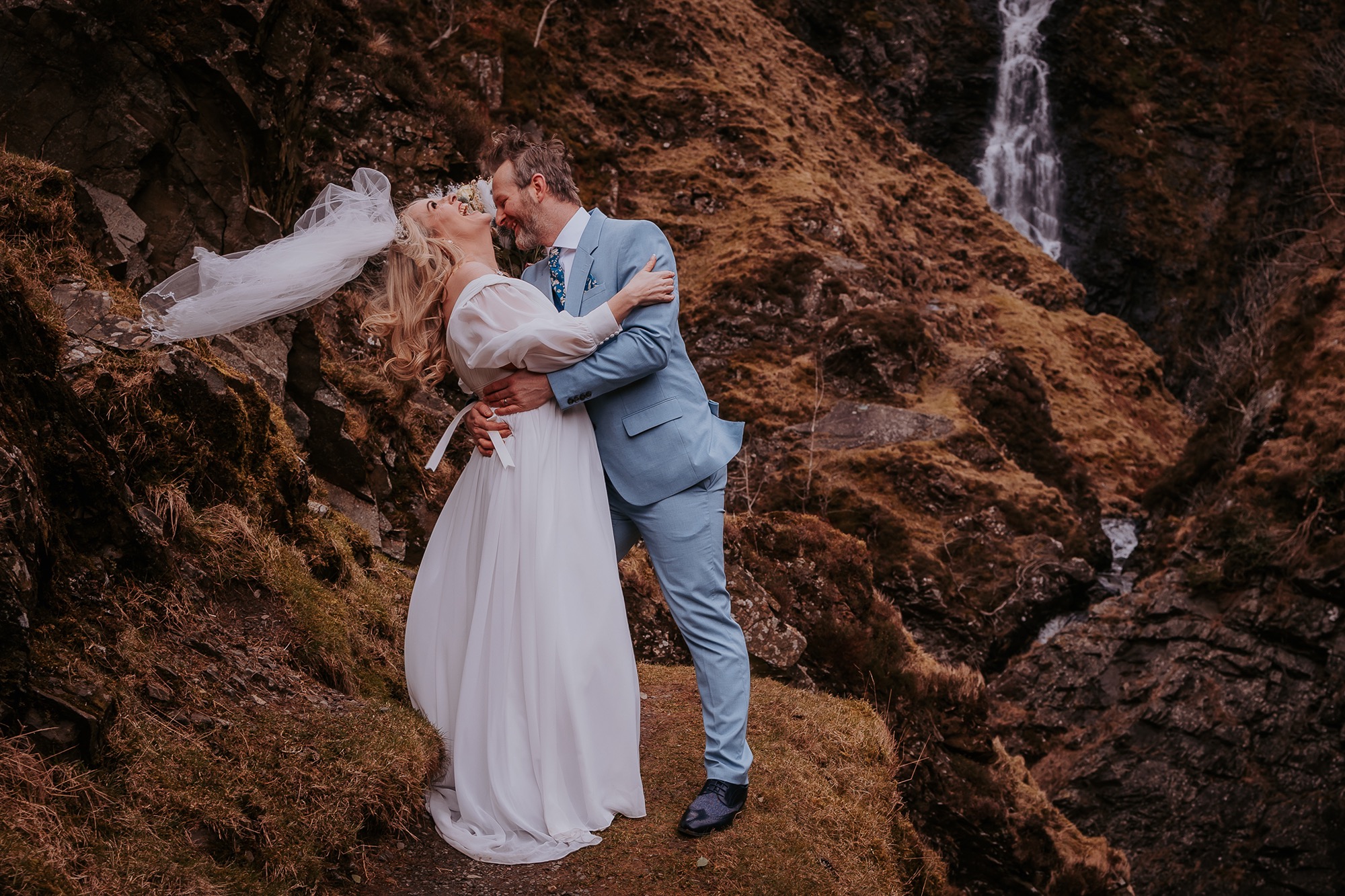 moment of fun with couple in Scottish fells