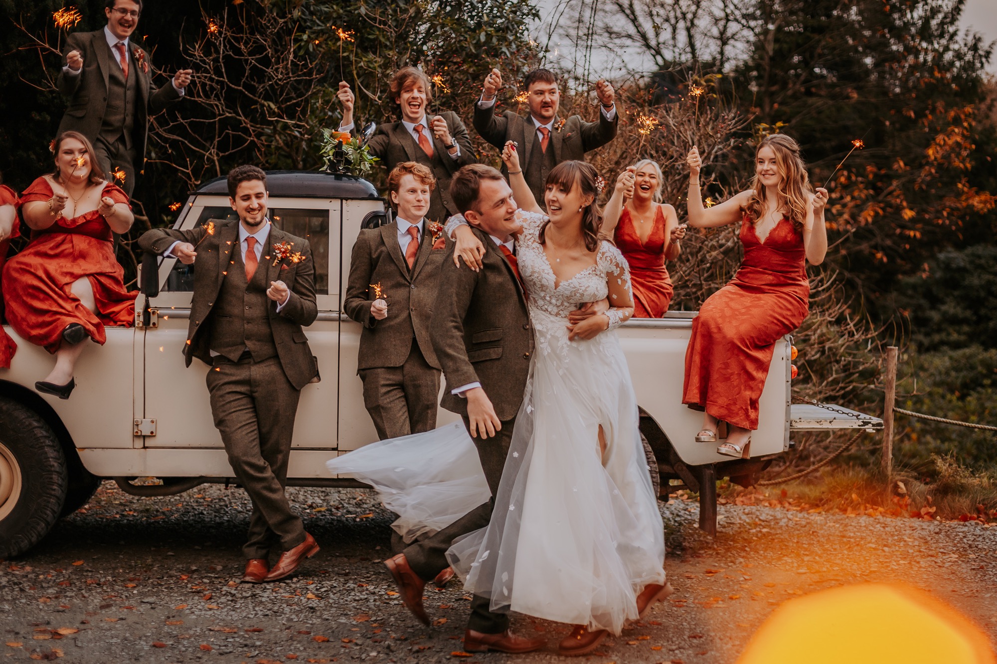 Vintage Landrover sets the backdrop for couple enjoying a dance