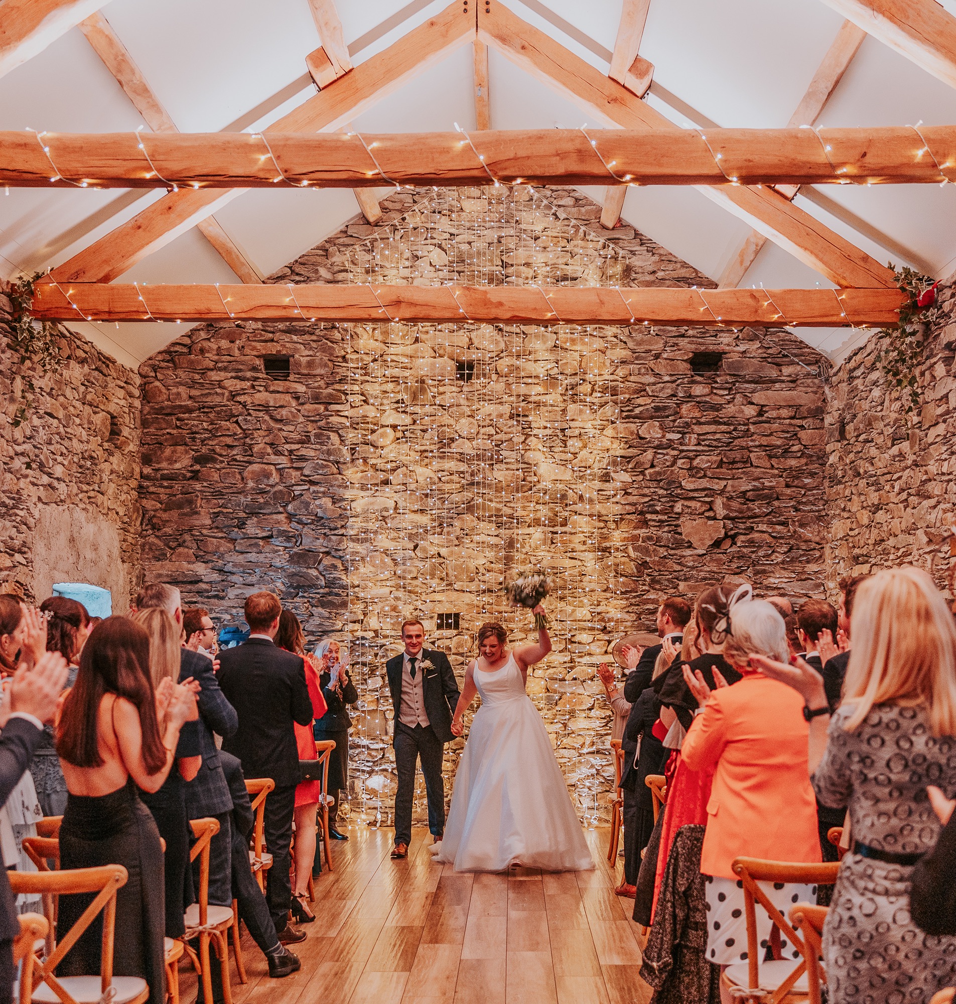 Couple Celebrating as they exit their wedding ceremony at Town Head Estate