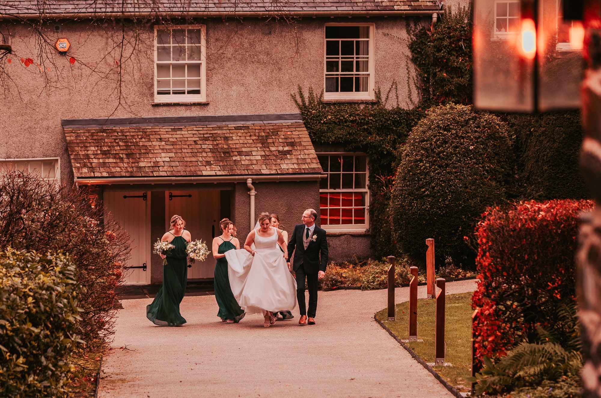 Bride making her way to her ceremony at Town Head Estate, Windermere wedding venue