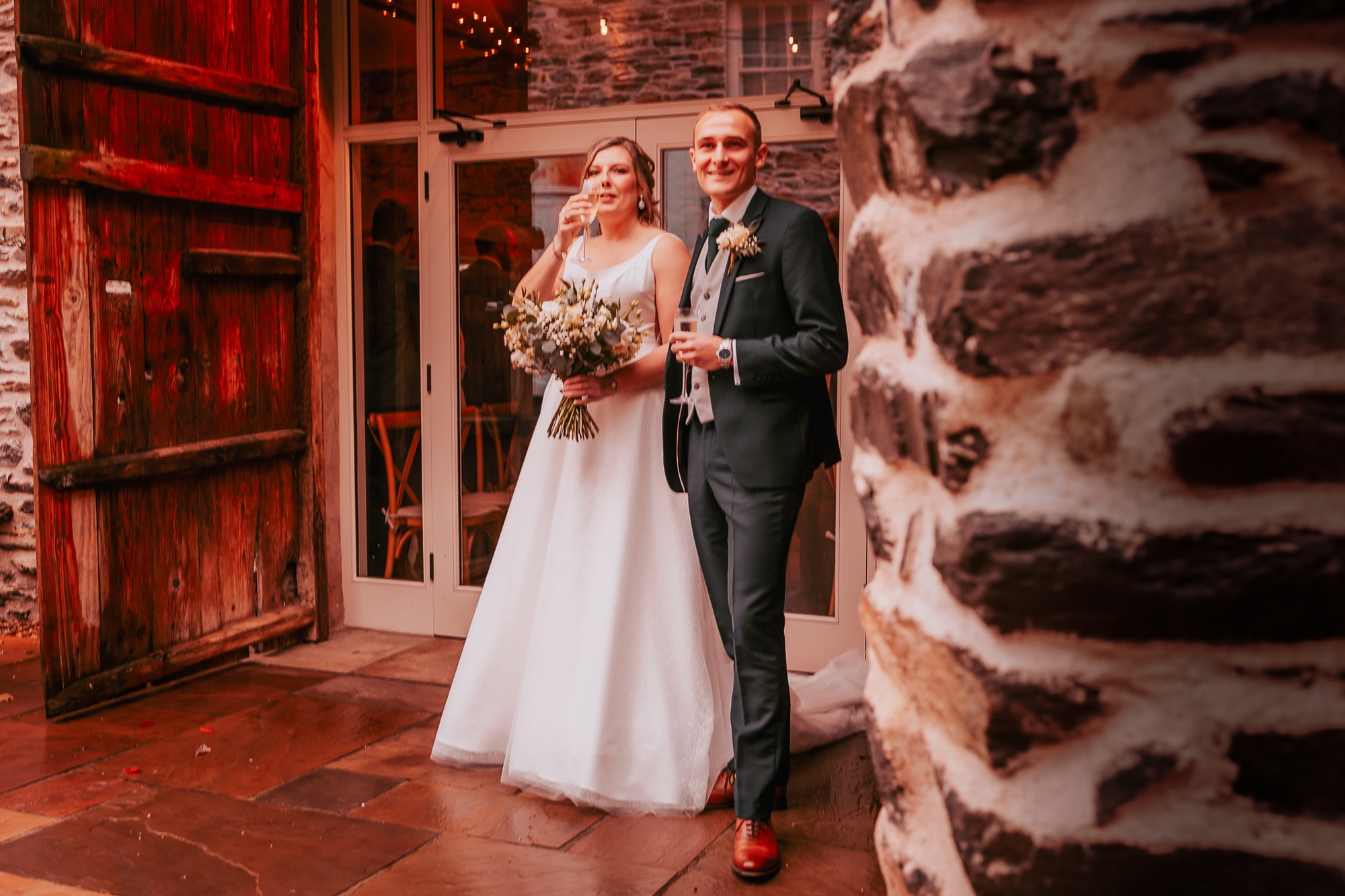 Wedding couple enjoying champagne at Town Head Estate