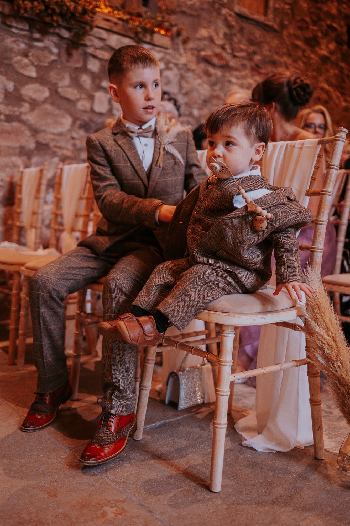 Brothers sit in Eden Wedding Barn waiting for mummy to walk down the aisle