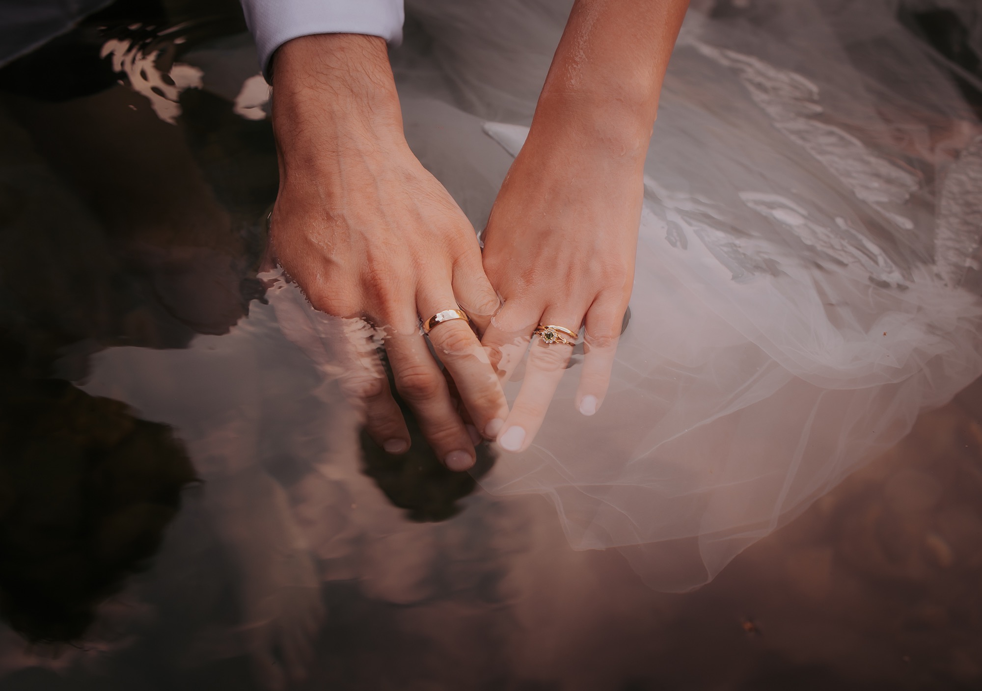 Just married - wedding rings photograph in the fairy pools at Coniston