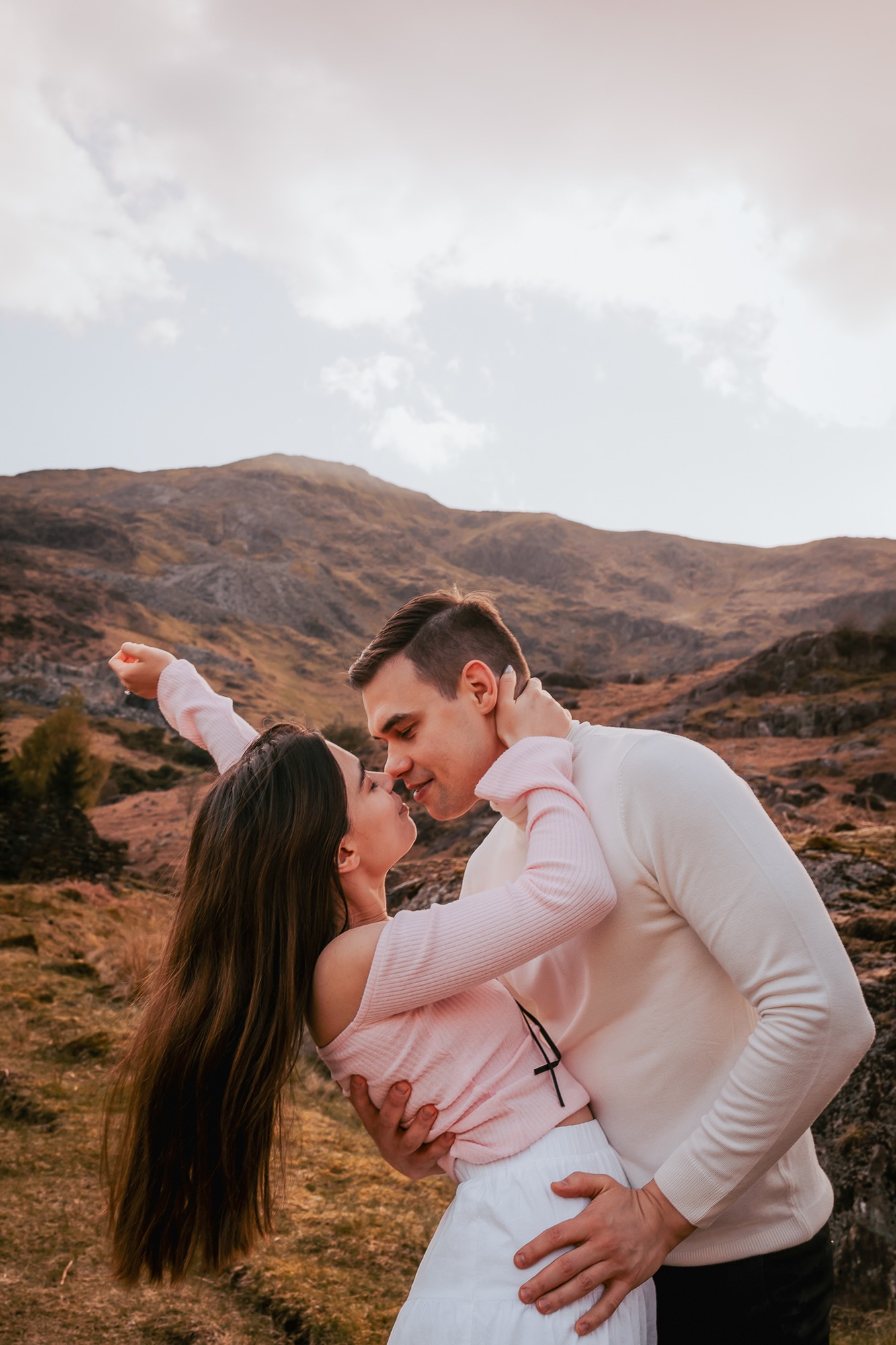 Mr and Mrs kissing on the side of a Lake District Wainwright