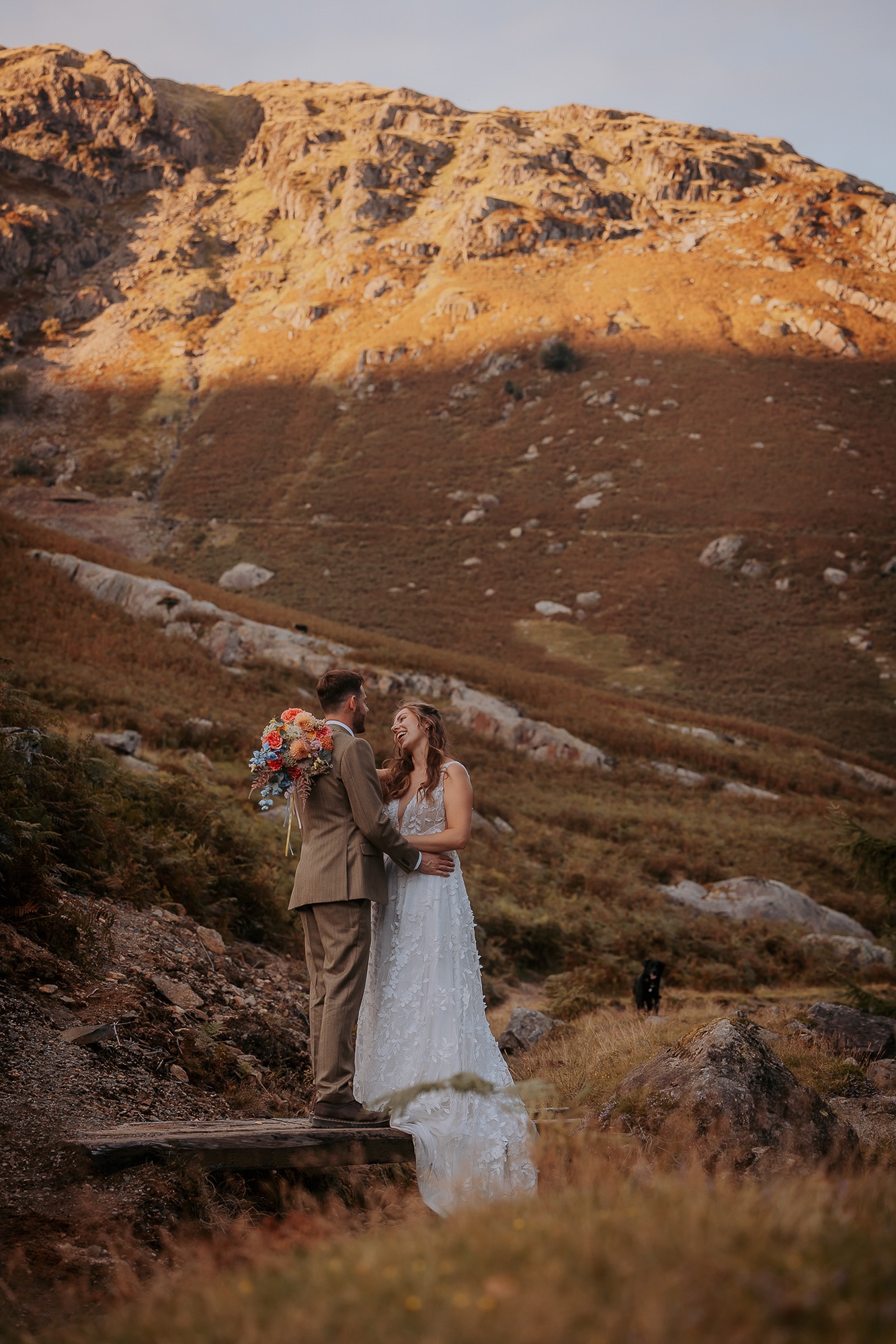 Bride and Groom on foot bridge near Coniston Coppermines wedding barn