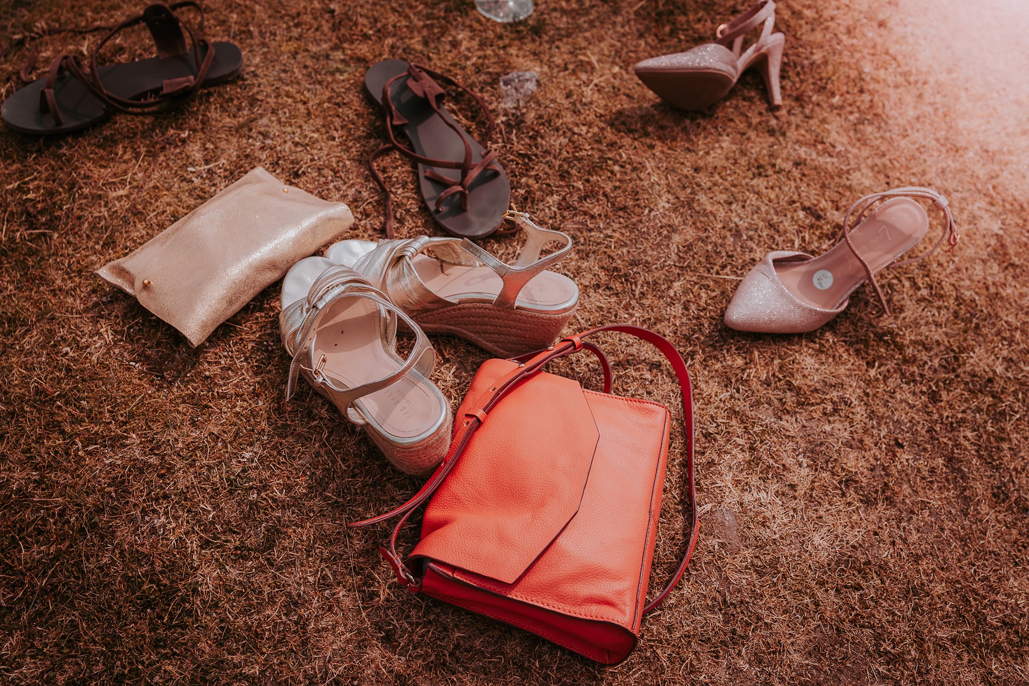 Bags down, shoes off, ahead of wedding guests heading in for a paddle at Coniston