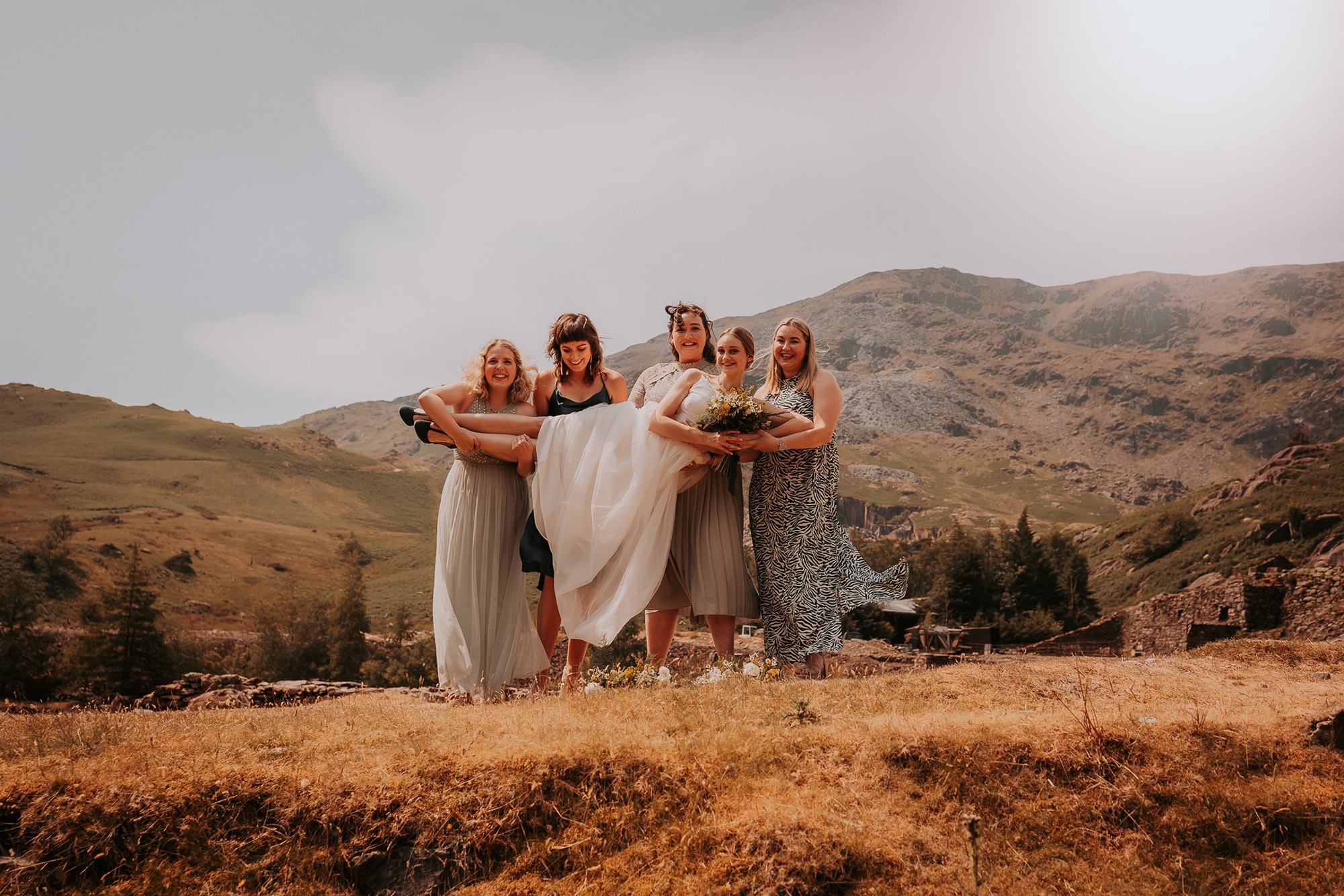 Bride and Bridesmaids pose in the Coppermines valley, Coniston