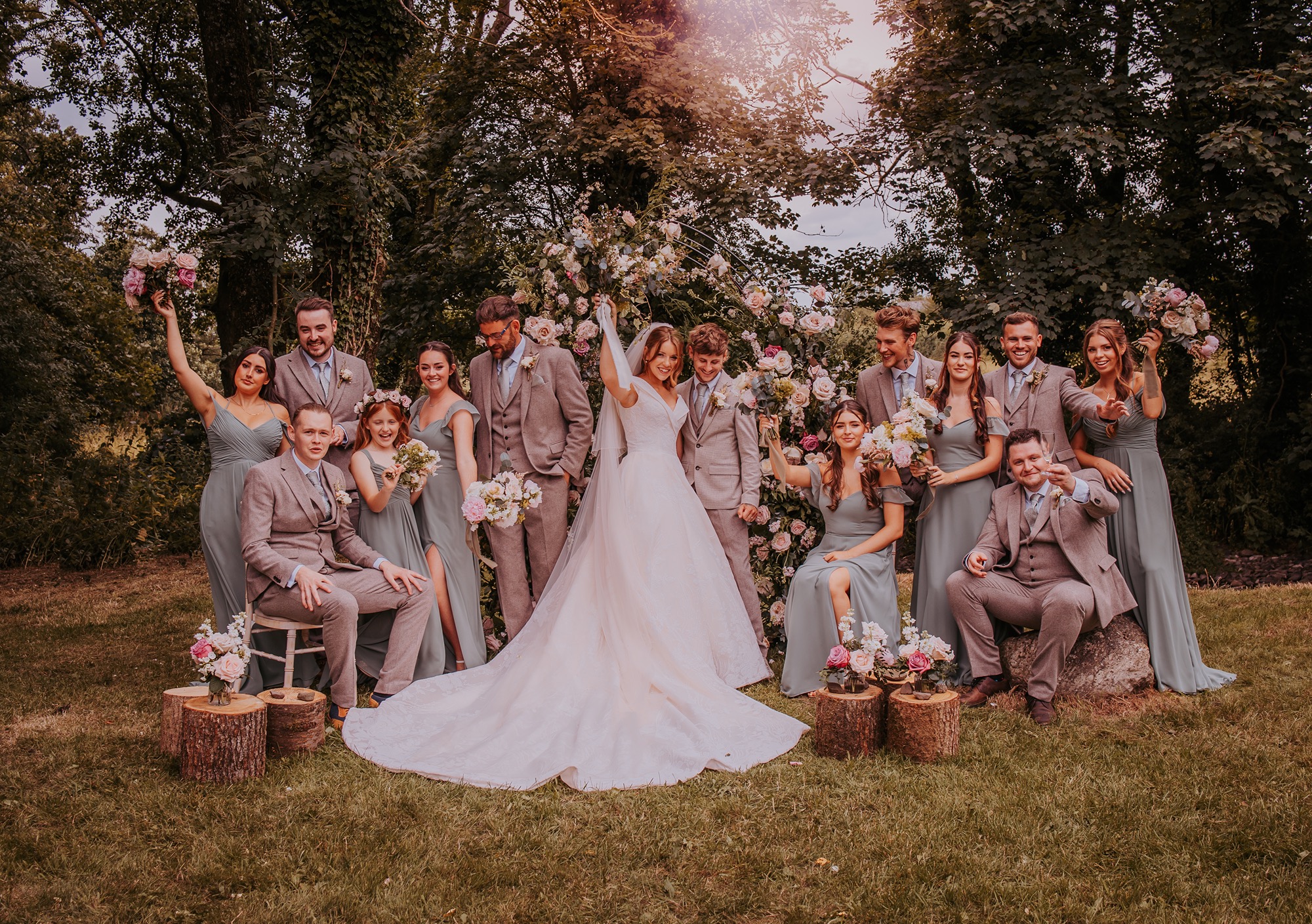 group wedding portrait with bride with long wedding dress train