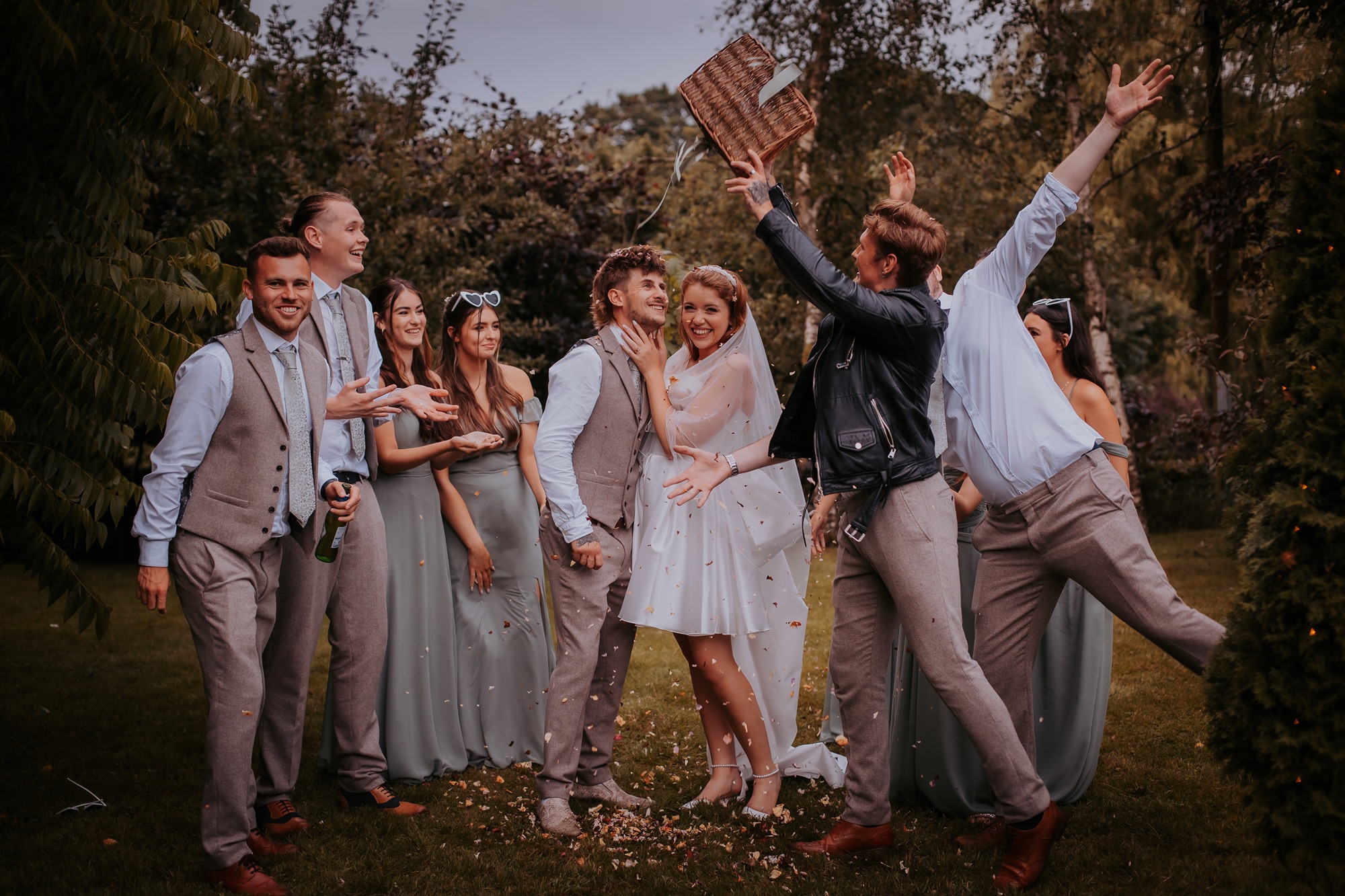 silly confetti moment with bridal party during country wedding celebration
