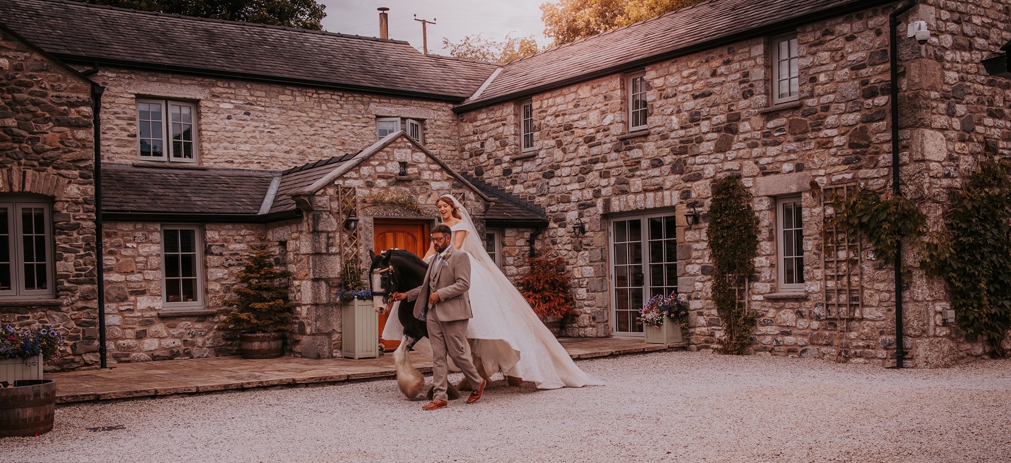 Bride riding horse ahead of walking down the aisle horseback