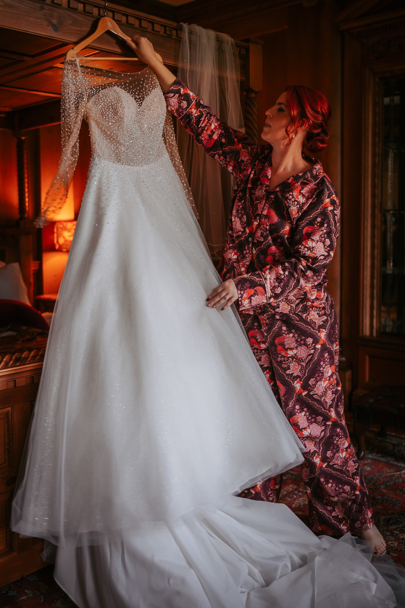 Bridal admiring her wedding dress before putting it on, Lake District