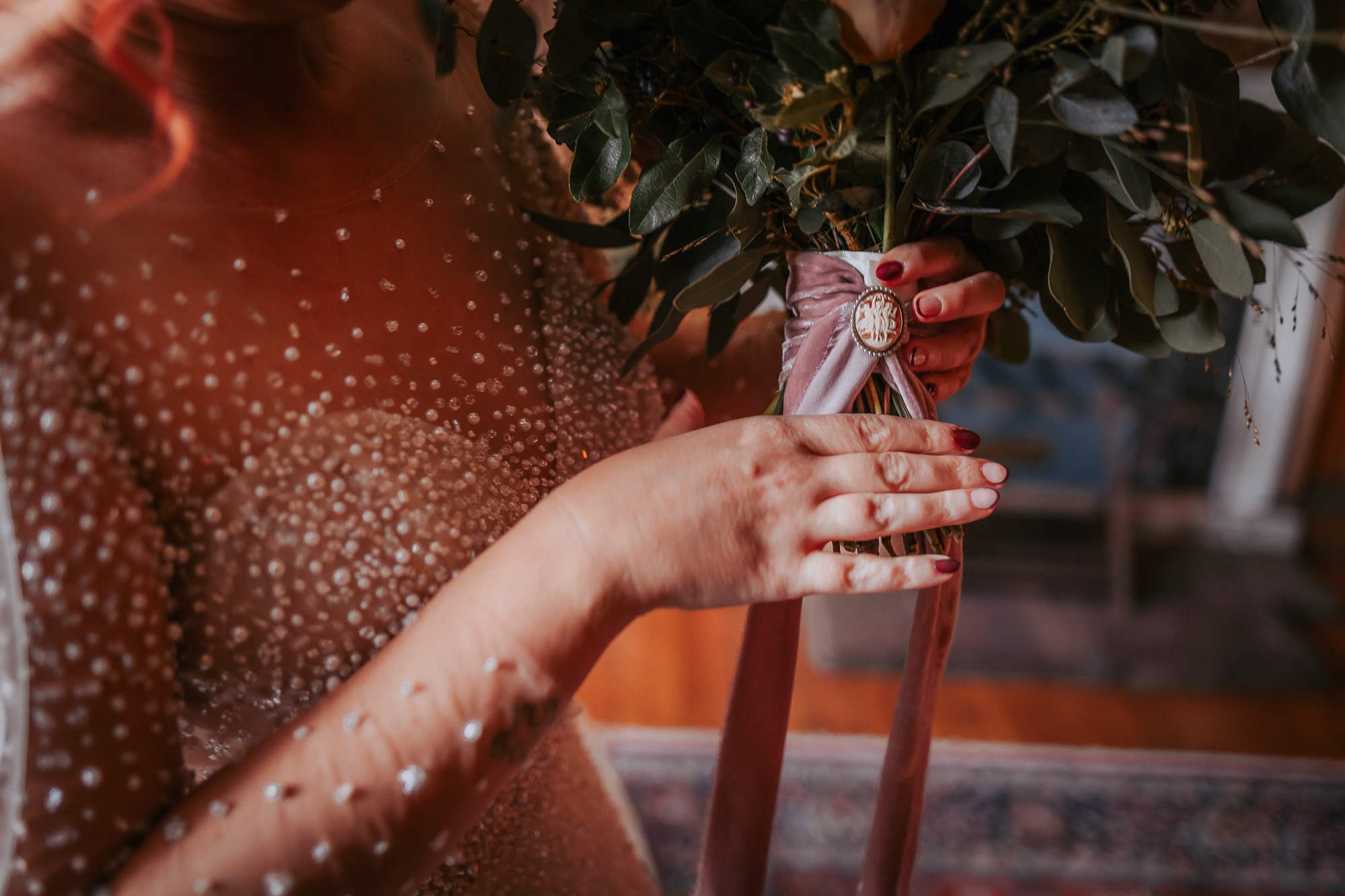 Detailed brooch on bridal bouquet