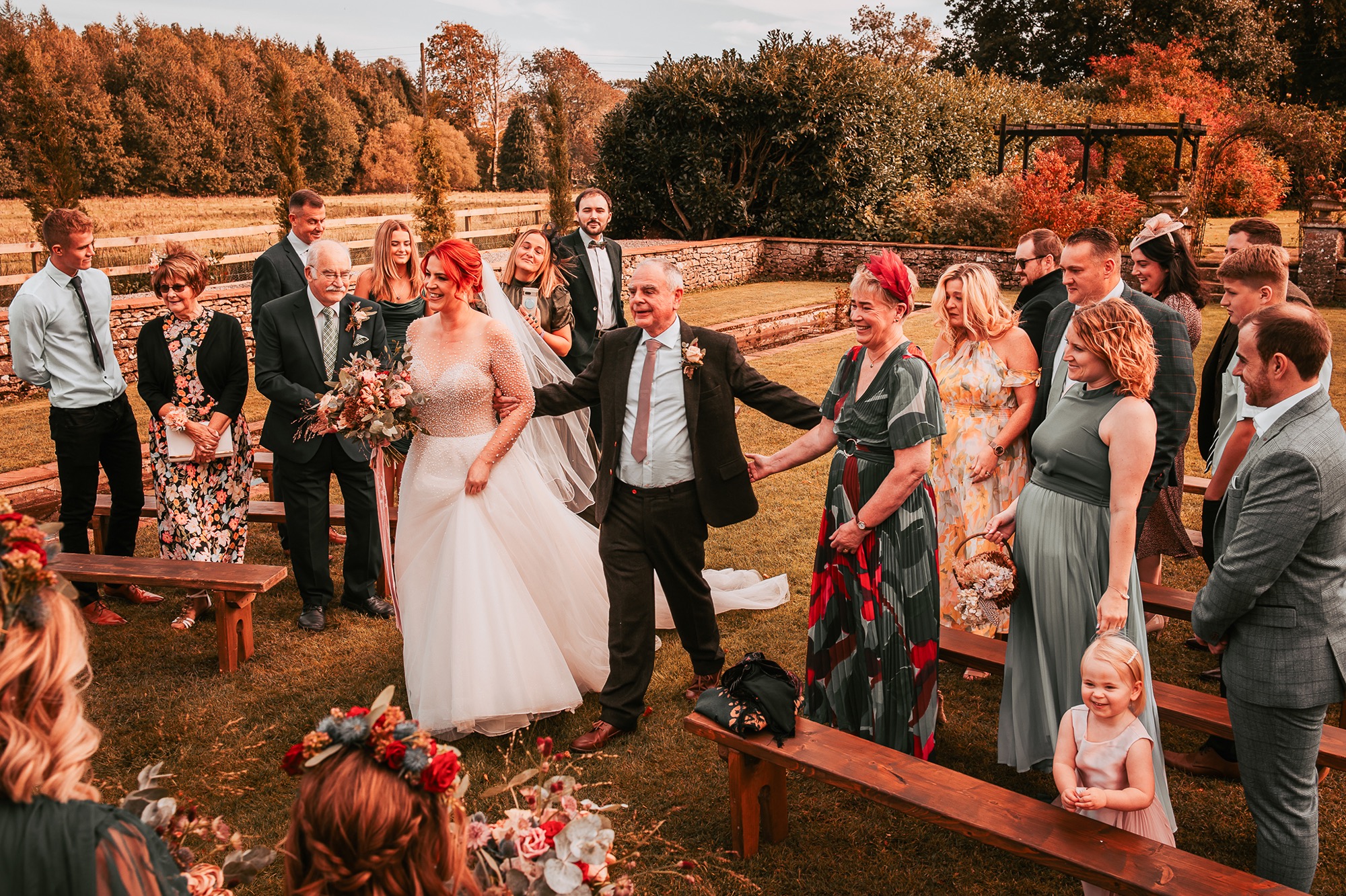 Father of the bride walking bride down the aisle at Holesfoot garden