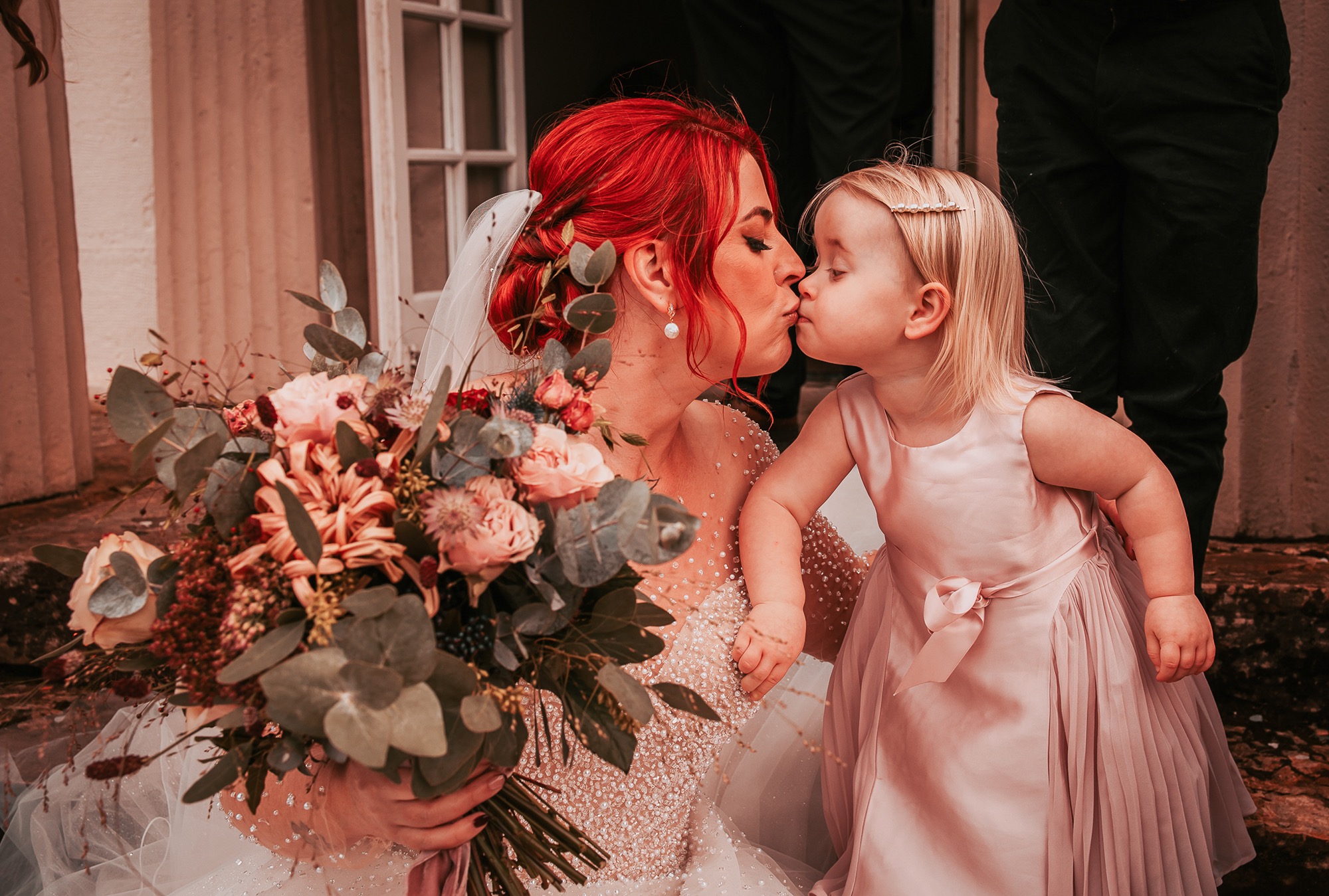 Flower girl kisses mum at wedding, Holesfoot, Penrith