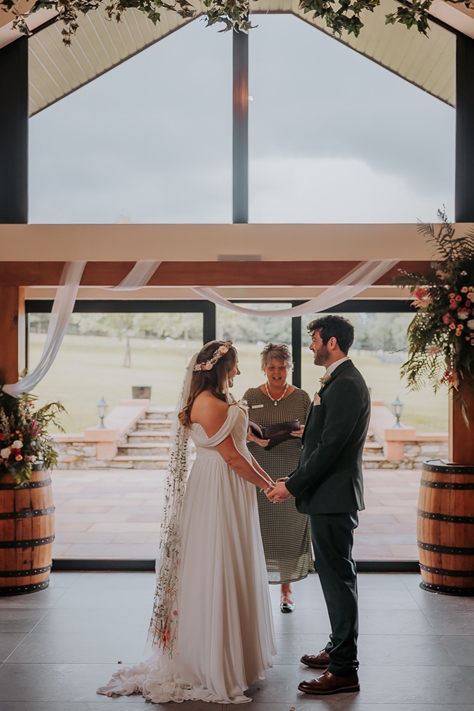 Bride and groom exchange vows with Cumbria registration service at New House Farm, Lorton