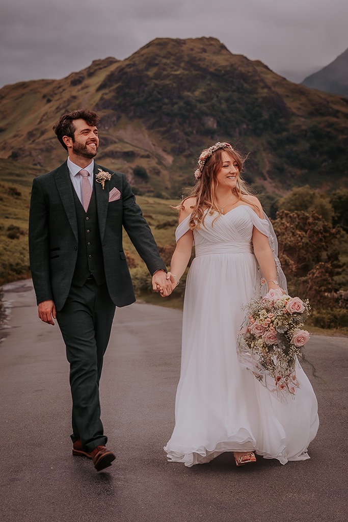 Bride and groom enjoy the scenery at Crummock water