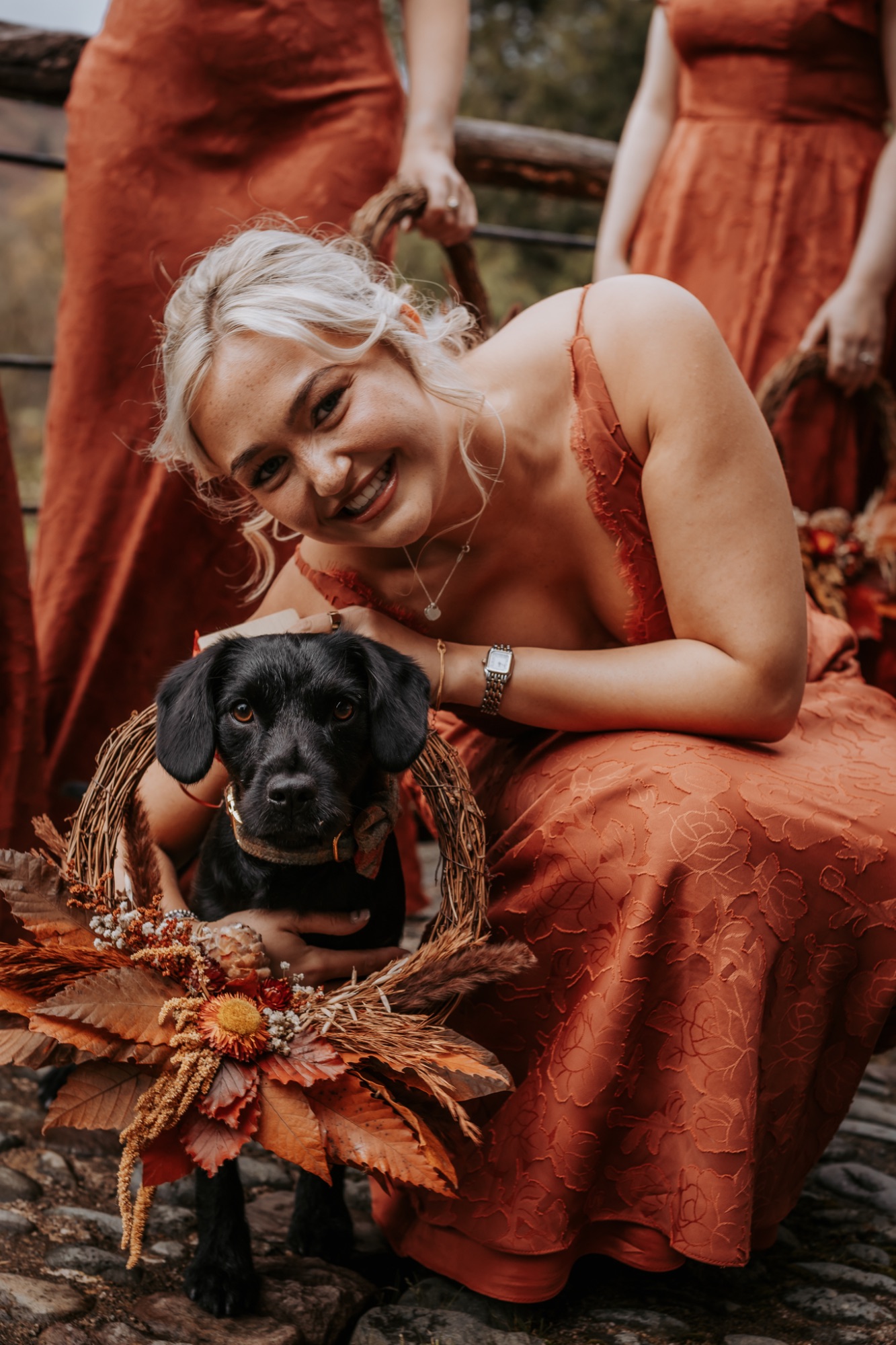 puppy with dried flower collar at Lancrigg, Grasmere wedding