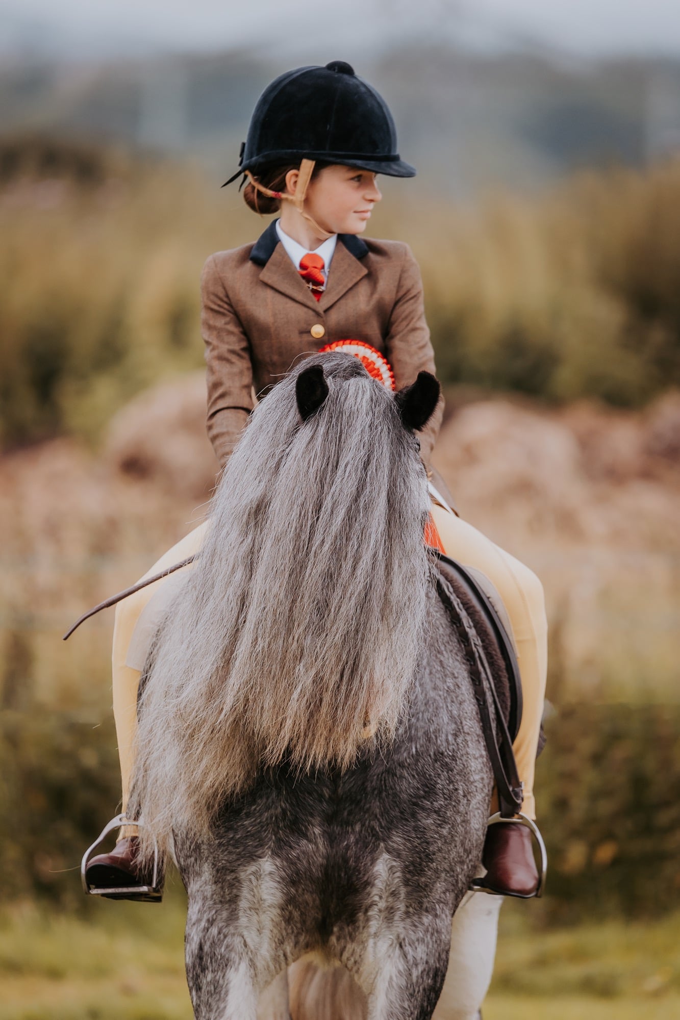 Young girl wins first place in a Cob equestrian class