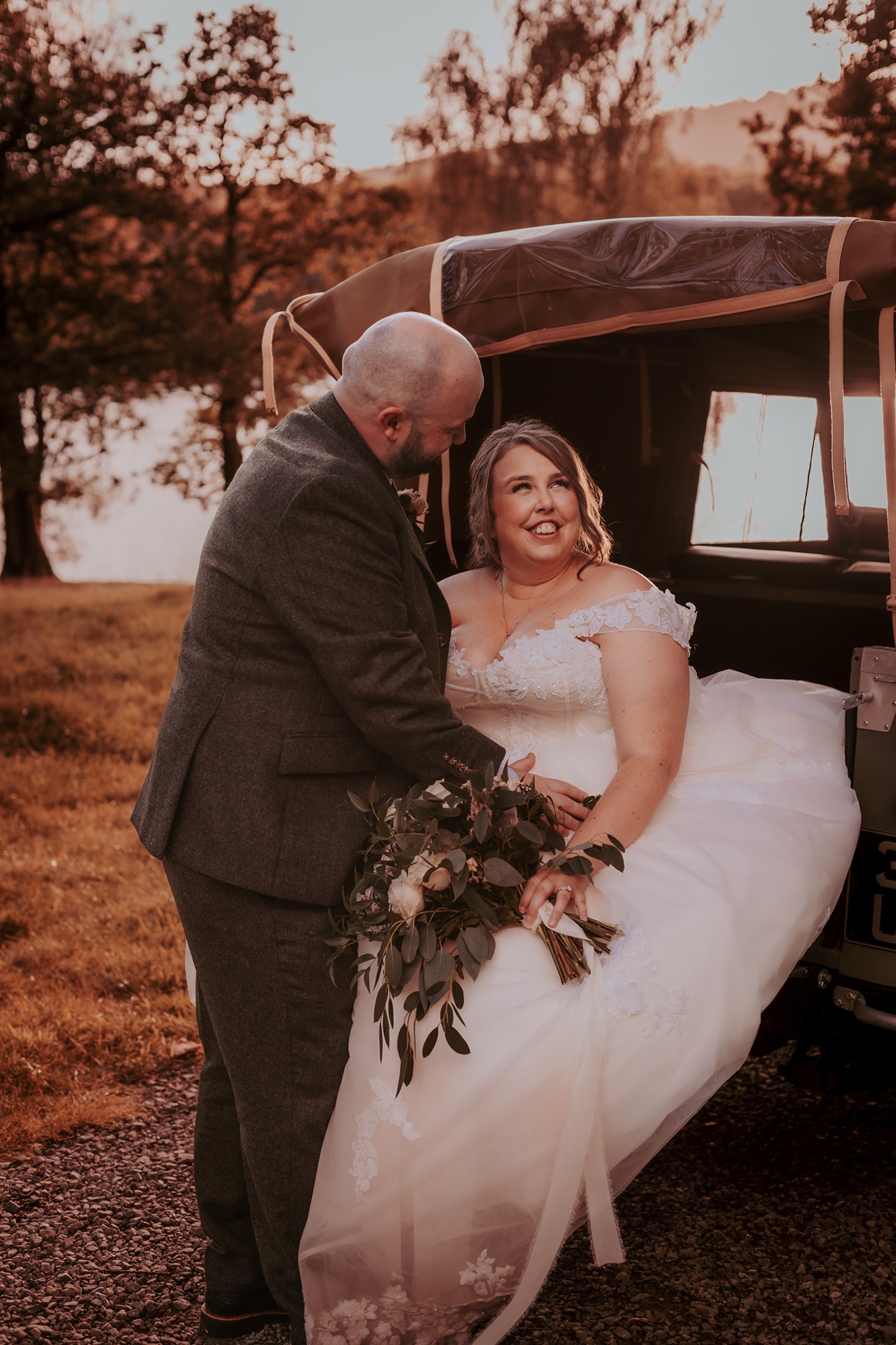 Groom looks lovingly at his new wife