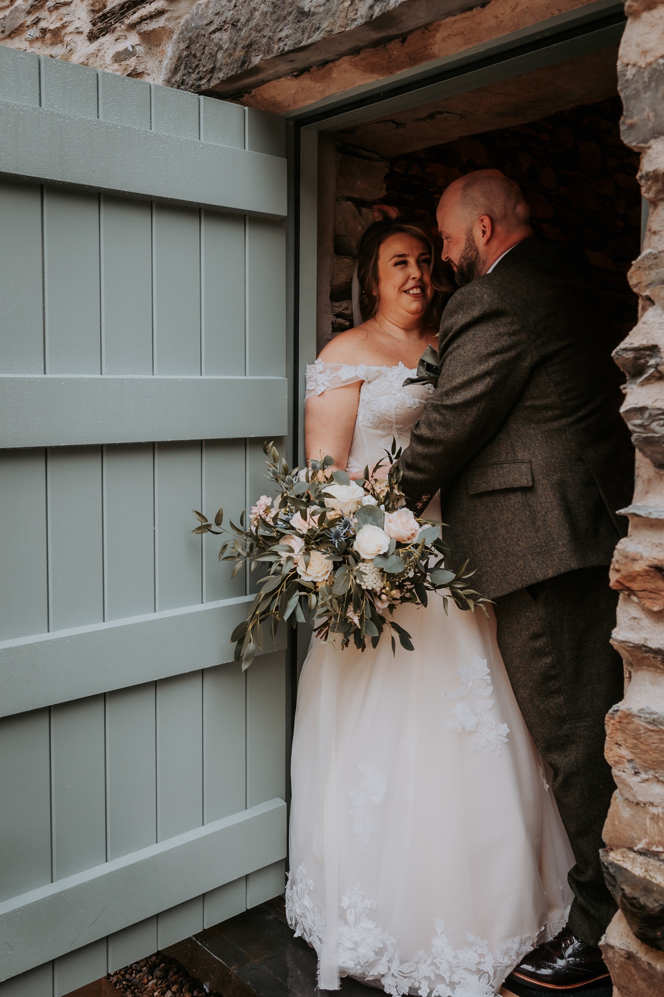 Bride and groom romance in doorway