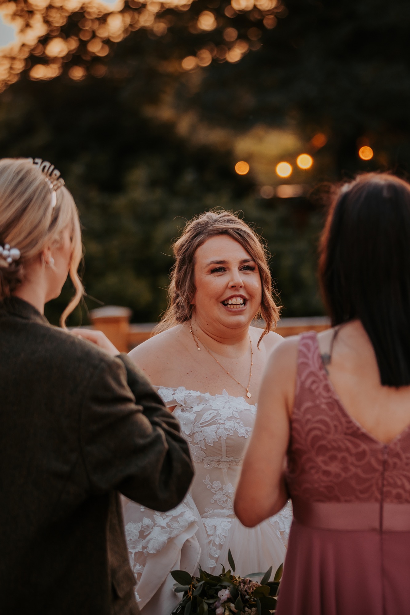 bride enjoying drinks outside in Town Head Estates gardens