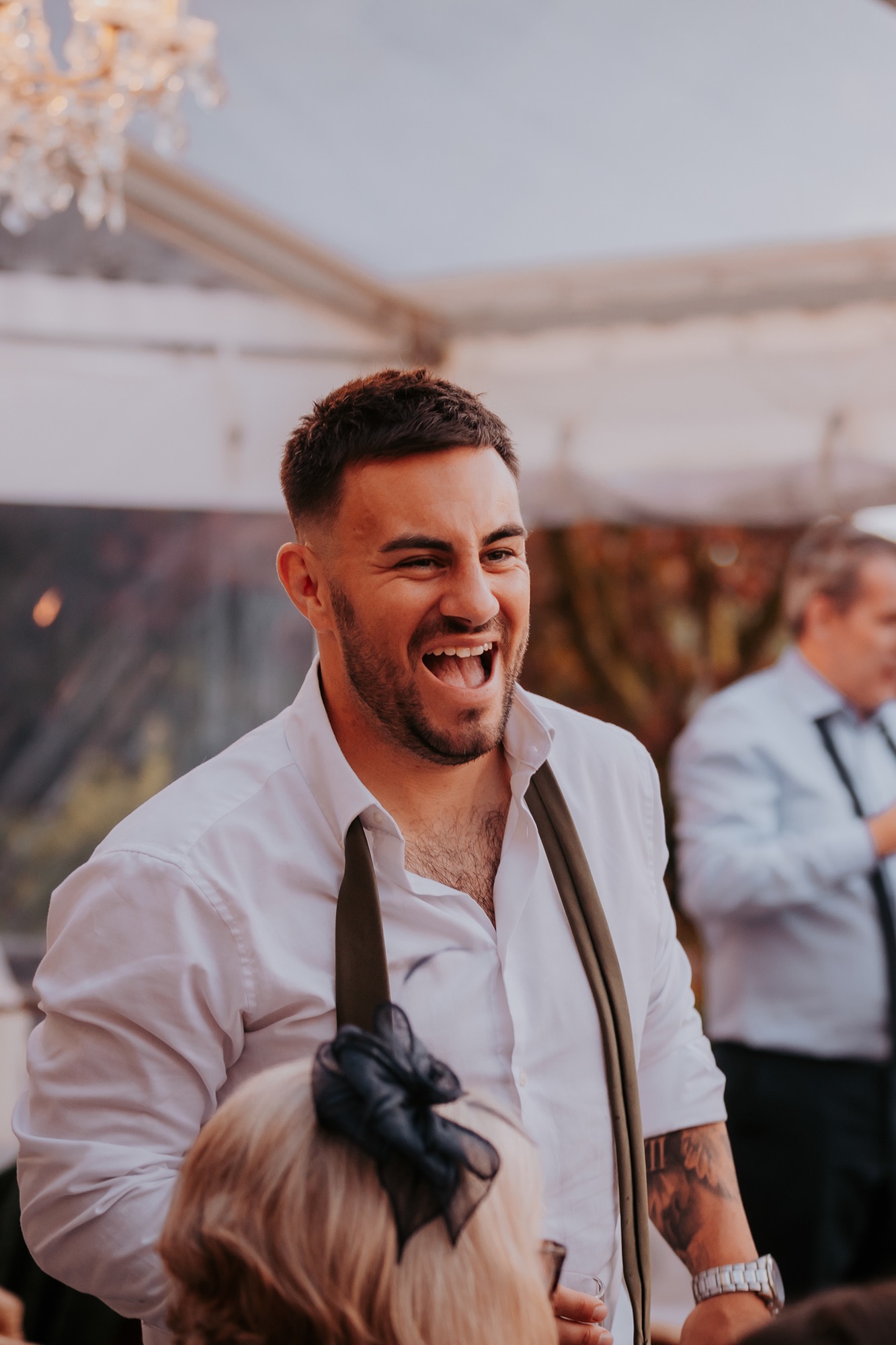 Happy guest at Town Head Estate wedding in the marquee