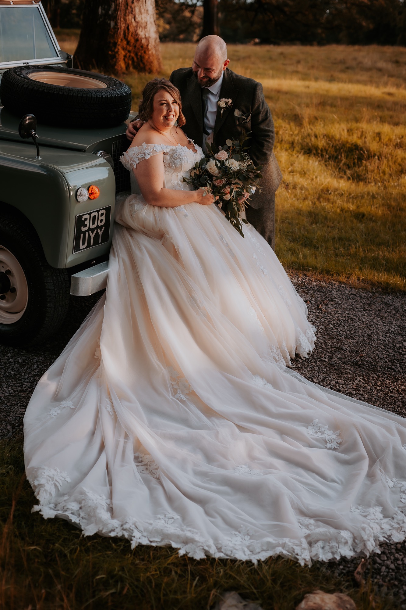 Bride and groom with vintage landrover, Town Head Estate