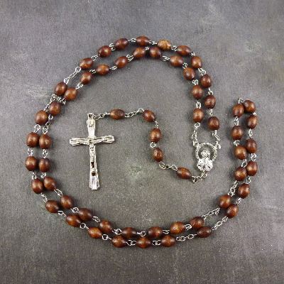 Dark brown oval wooden rosary beads with silver center 56cm length