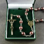 Large brown pearly rosary with filigree covered paters boxed