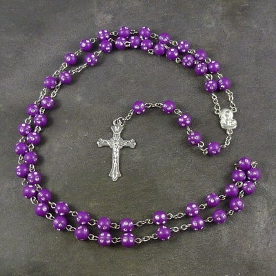 Purple plastic round rosary beads with silver spotted detail 