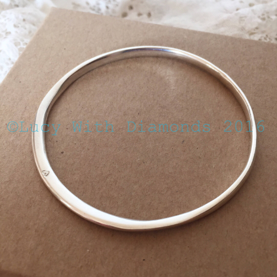 Silver polished bangle with heart contour bangle with heart star stamp vale