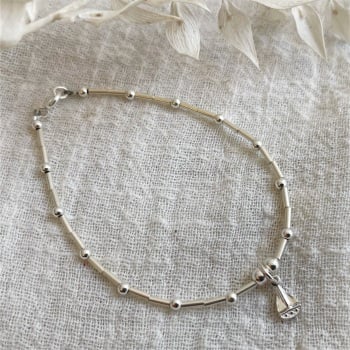Beaded sterling silver bracelet with boat charm