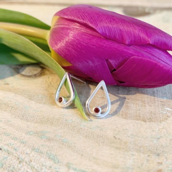 Teardrop silver stud earrings with garnet