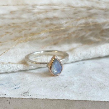 Moonstone set in 9ct rose gold on silver band