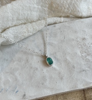 Emerald solitaire pendant in sterling silver