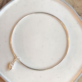 A. Round bangle with shell charm