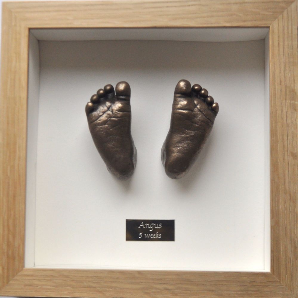 Bronze resin pair of feet Framed