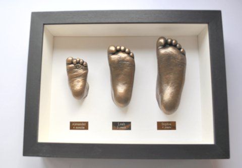 Sibling bronze feet framed 