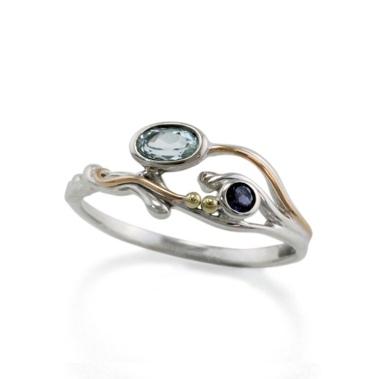 Banyan Gentle Flowing Ring with Blue Topaz, Iolite and Gold Fill Details.
