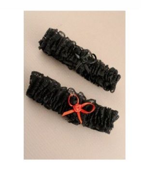Black brides lace garter with ribbon bow. Black and black with red bow