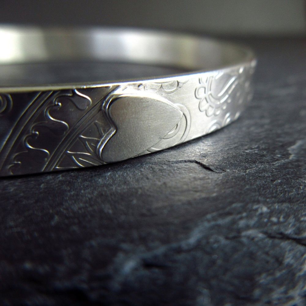 Sterling Silver Bangle with Silver Heart and Embossed Swirl Pattern